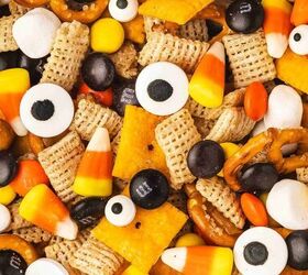 spooky halloween snack mix easy kid friendly recipe, Close up of Halloween snack mix showing Chex Cheez Its pretzels candy corn mini marshmallows candy coated chocolates and candy eyes
