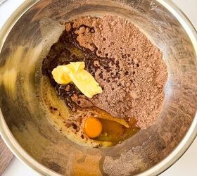 pumpkin cheesecake brownies recipe for fall desserts, Mixing bowl with cocoa powder butter sugar and an egg ready to be blended for brownie batter