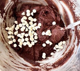 pumpkin cheesecake brownies recipe for fall desserts, Chocolate brownie batter in a bowl with white chocolate chips sprinkled on top before stirring
