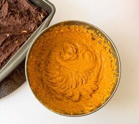 pumpkin cheesecake brownies recipe for fall desserts, Pumpkin batter fully mixed in a bowl next to a pan of chocolate brownie batter