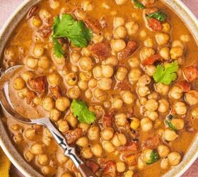easy raspberry moscow mule party ready mint cocktail, A creamy 5 ingredient chickpea curry served in a white bowl garnished with fresh cilantro and ready to enjoy with rice or naan