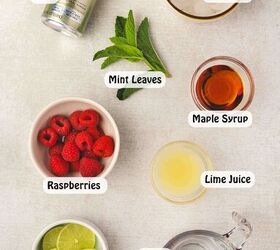 easy raspberry moscow mule party ready mint cocktail, Fresh raspberries lime vodka ginger beer maple syrup and mint arranged for a Moscow Mule cocktail