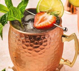 easy raspberry moscow mule party ready mint cocktail, Refreshing Strawberry Moscow Mule cocktail in copper mug with fresh mint and lime garnish
