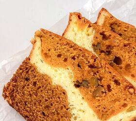 perfectly moist cream cheese pumpkin bread recipe, Three slices of cream cheese pumpkin bread laid on parchment paper showing the creamy cheesecake style layer and moist crumb
