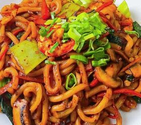 perfectly moist cream cheese pumpkin bread recipe, Close up of shrimp yaki udon stir fry with bok choy mushrooms carrots and green onions on a white plate