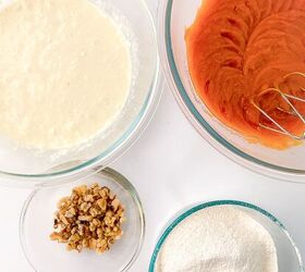 perfectly moist cream cheese pumpkin bread recipe, Mixed cream cheese filling and pumpkin batter in glass bowls with chopped walnuts and sifted dry ingredients arranged on a white surface for making cream cheese pumpkin bread