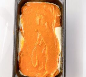 perfectly moist cream cheese pumpkin bread recipe, Loaf pan filled with alternating layers of pumpkin batter and cream cheese mixture ready to bake