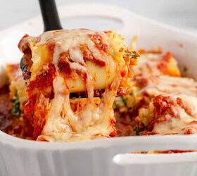 spinach lasagna roll ups, Spinach Lasagna Roll Ups Cheese Pull Being Lifted from the Baking Dish