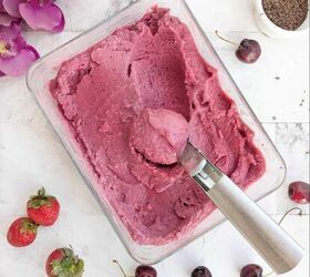 chia berry oat crumble, A scoop of vegan ice cream in a bowl with cherries and strawberries Chocolate shavings in the background
