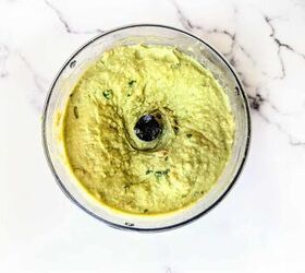 easy creamy all in one avocado chickpea hummus, An image of avacodo hummus blended in a small food processor