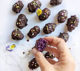 chocolate bounty blueberry bites, Chocolate Bounty Blueberry Bites with a hand holding one half eaten