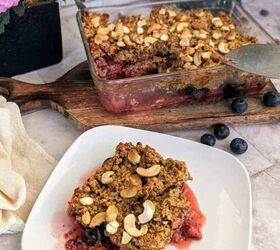 chia berry oat crumble, A dish and a plate displaying chia berry oat crumble wuth a few blueberries as decoration