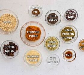 pumpkin spice protein energy balls, PUMPKIN PIE SPICE NENERGY BALL INGREDIENTS IN CLEAR BOWLS ON WHITE SURFACE