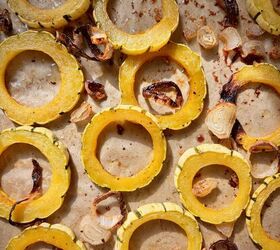 roasted delicata squash salad with maple brown butter dressing, Golden roasted delicata squash and shallots on a baking sheet before assembling the salad