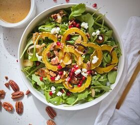 roasted delicata squash salad with maple brown butter dressing, Plated roasted squash salad topped with crumbled goat cheese and pomegranate seeds