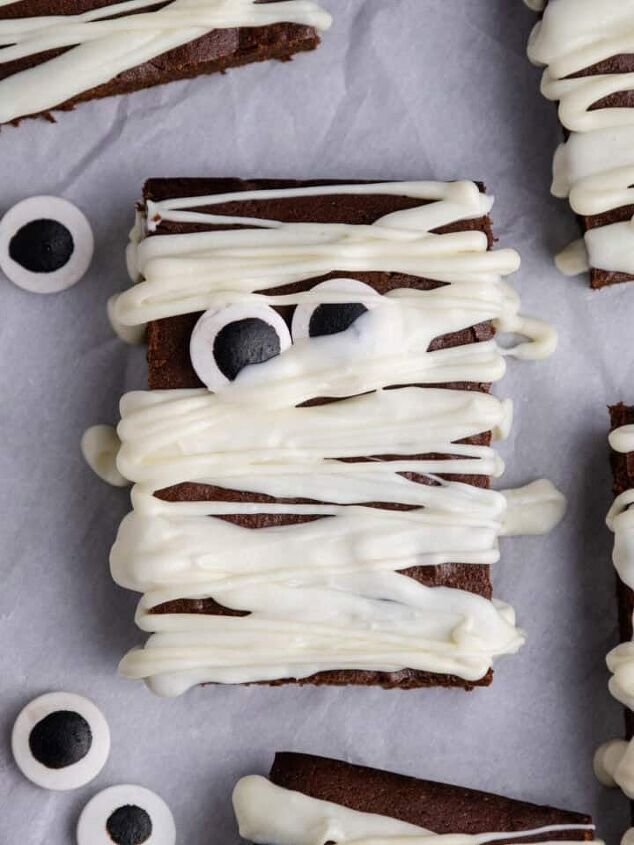 cranberry sauce bread, Mummy Brownie with googly eyeballs on parchment paper