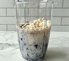blueberry protein shake, All blueberry protein shake ingredients in a clear blender cup