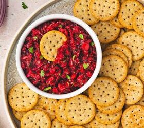 easy cranberry jalapeno salsa holiday dip made with frozen cranberri, Top view of cranberry jalape o salsa with cilantro and lime in white bowl