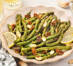 easy oven roasted green beans with garlic and lemon, Oven roasted green beans with garlic lemon zest and toasted almonds on a parchment lined tray
