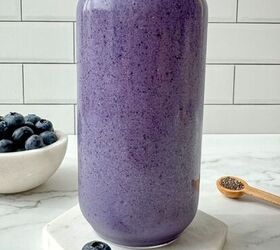 detox island green smoothie tropical smoothie cafe copycat, Blueberry protein shake in a clear glass with a straw Blueberries chia seeds and nuts surround the glass