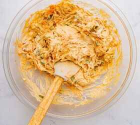 buffalo chicken egg rolls air fryer recipe, Buffalo chicken filling mixed in a large bowl with a spatula