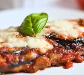 sicilian caponata with raisins celery fresh herbs, Baked Eggplant Parmesan Without Breadcrumbs Recipe on a white plate