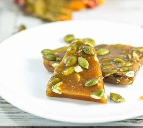best pumpkin seeds brittle sweet nutty crunchy, Pumpkin seed brittle triangle pieces on a white plate with autumn decor in the background