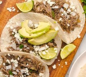 loaded baked potato with brisket, Three barbacoa tacos on a cutting board with diced onions and avocado slices