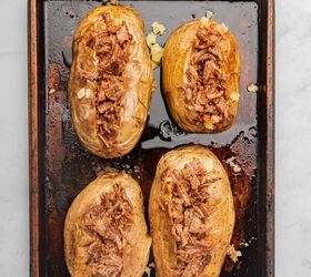 loaded baked potato with brisket, Four baked potatoes with brisket loaded into the center of each potato
