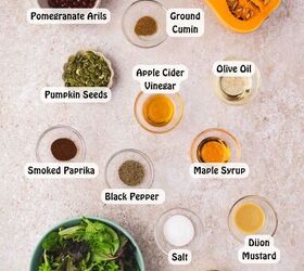 easy roasted butternut squash feta salad holiday side salad, Ingredients for butternut squash feta salad laid out on a counter butternut squash olive oil smoked paprika cumin salt pepper mixed greens pomegranate seeds feta pumpkin seeds and salad dressing ingredients