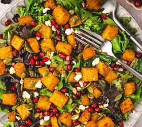 easy roasted butternut squash feta salad holiday side salad, Bowl of roasted butternut squash feta salad with a drizzle of dressing