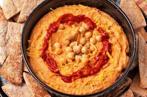 This easy homemade harissa hummus will impress everyone at your table