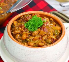 cowboy bbq baked beans, a bowl of cowboy bbq baked beans with onion bell pepper and bacon garnished with parsley