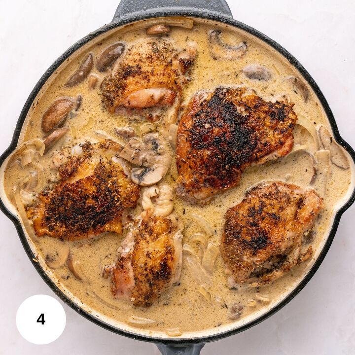 juicy chicken marsala thighs gf one skillet, A skillet filled with five seasoned browned chicken thighs simmers in a creamy gluten free mushroom sauce with sliced mushrooms and onions This rich and savory one skillet dish is pictured with a white circle showing the number 4 in the bottom left corner