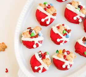 easy christmas oreos santa s toy bag oreos recipe, A neat tray of red and white dipped Oreo cookies decorated with holiday candy pieces and teddy bear crackers