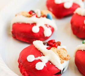 easy christmas oreos santa s toy bag oreos recipe, Side angle of Christmas Oreo cookies on a white platter showing details of candy toppings and white frosting trim