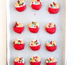 easy christmas oreos santa s toy bag oreos recipe, A tray filled with decorated red and white cookies that look like festive Christmas stockings