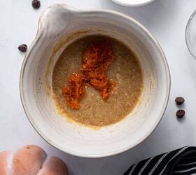 easy pumpkin mug cake recipe with chocolate chips, Pumpkin mug cake ingredients being added to the bowl for mixing