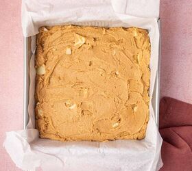 biscoff blondies with white chocolate cookie butter, Biscoff blondies batter being transferred to the metal baking pan