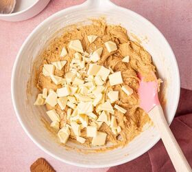 biscoff blondies with white chocolate cookie butter, Chopped white chocolate bar being added to the biscoff blondie batter