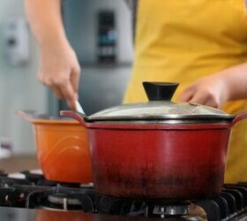 dolma recipe make delicious turkish grapevine rolls at home in 1 hour, a woman in an apron is cooking on the stove