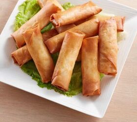 spring rolls recipe crispy air fryer spring rolls, Air Fryer Spring Rolls Stacked on a Plate