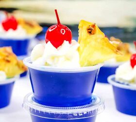 malibu jello shots, blue raspberry Malibu Jello shots garnished with a pineapple wedge whipped cream and a marachino cherry