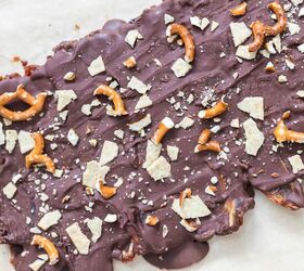 christmas crack date bark refined sugar free gluten free dairy free, melted chocolate poured over the date layer topped with pretzels and almond flour crackers for making christmas crack date bark