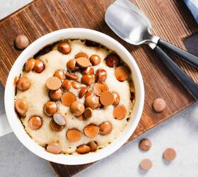 chocolate chip mug cake easy mug cake recipe, Overhead image of a chocolate chip mug cake on a wooden cutting board