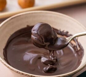 biscoff truffles recipe easy no bake cookie truffles, The biscoff cookie balls being dipped in dark chocolate for coating