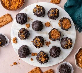 biscoff truffles recipe easy no bake cookie truffles, Overhead shot of homemade Biscoff truffles with crushed cookies scattered around perfect for gifting during the holiday season on a marble platter