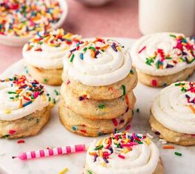 funfetti birthday cake cookies with sprinkles recipe, Frosted funfetti birthday cookie on parchment with extra sprinkles scattered