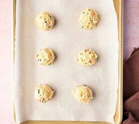funfetti birthday cake cookies with sprinkles recipe, Cookie scoop portioning funfetti dough onto lined baking sheet