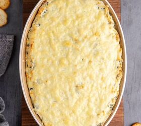 pretzel christmas treats, Baked Spinach and Artichoke Dip in Oval Baking Dish with Golden Cheese Top Layer and Crackers Beside
